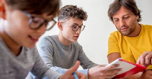 A pair of teens engage in motivation activities for high school students to stay engaged in school.